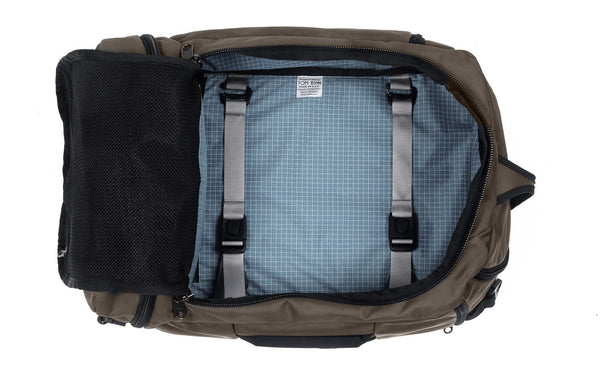 An open Techonaut 30 with a Ursa (brown) exterior and a Tidal (pale blue) interior.
